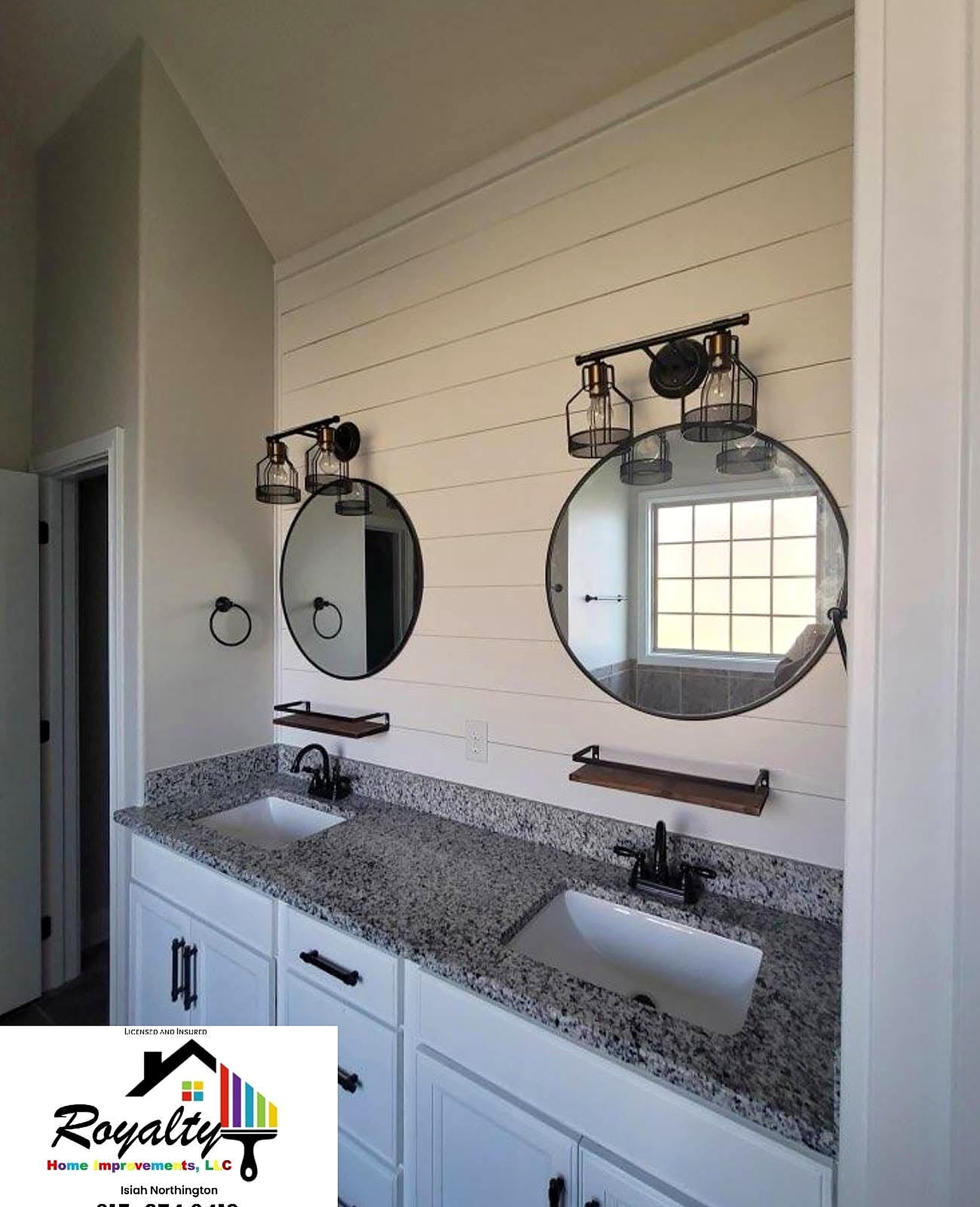 Refreshed bathroom vanity wall with clean white paneling