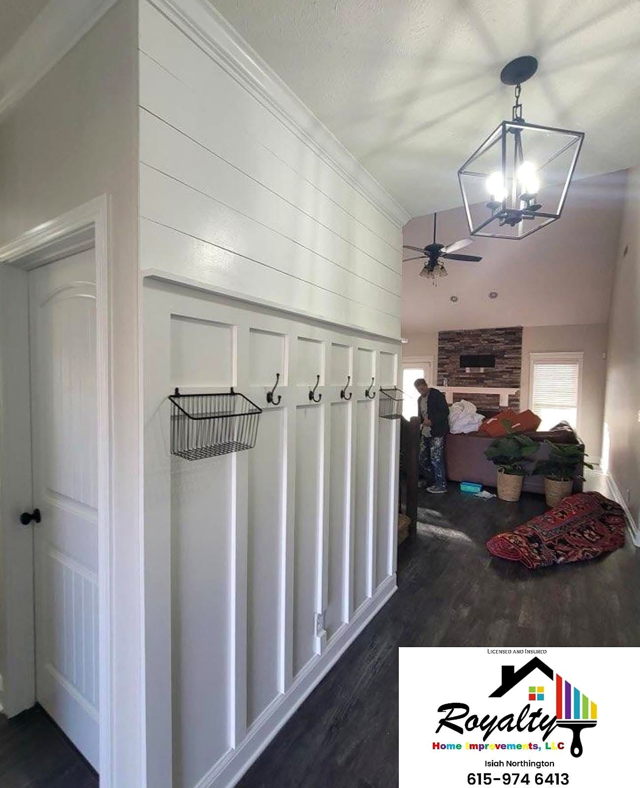 Finished hallway with white wainscoting and gray walls