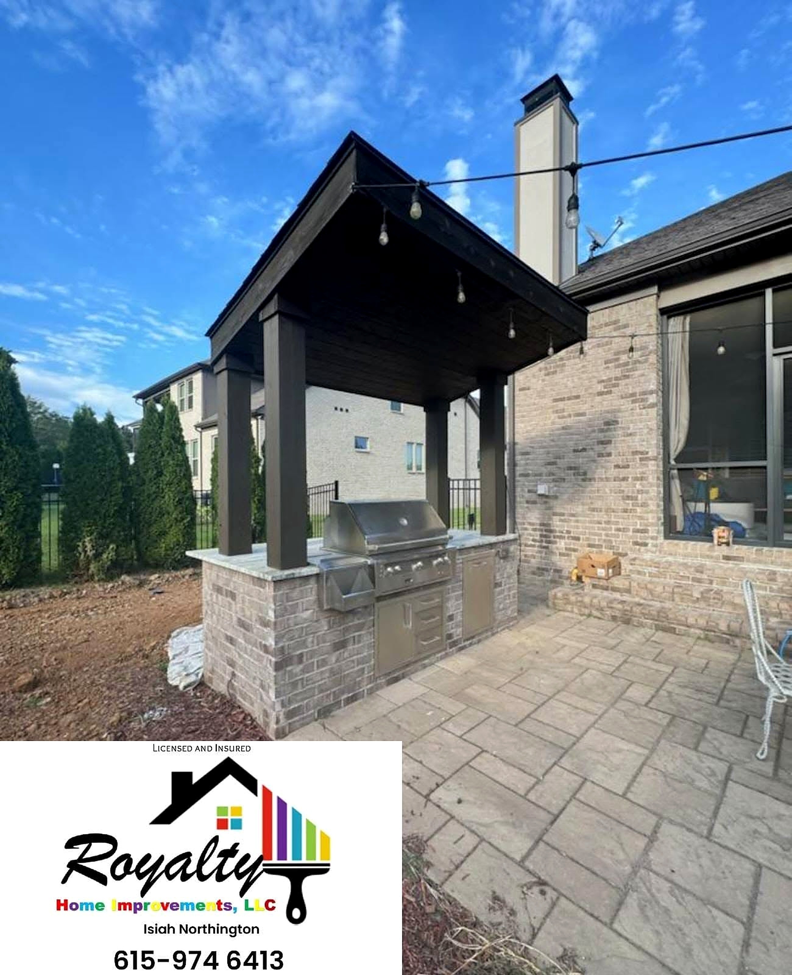 Finished dark exterior pavilion with stone columns and pavers