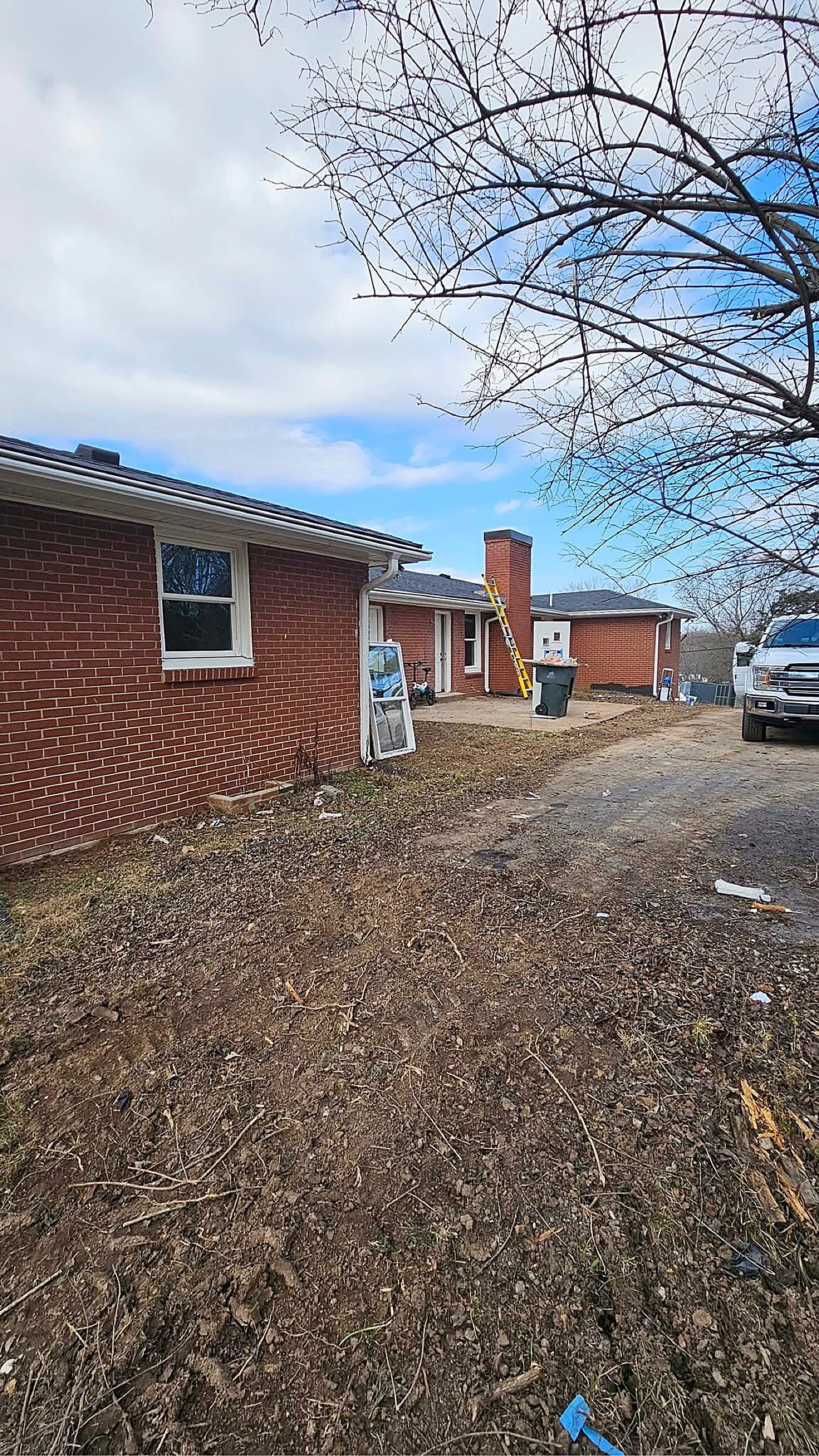 Refreshed brick home exterior with clean painted trim