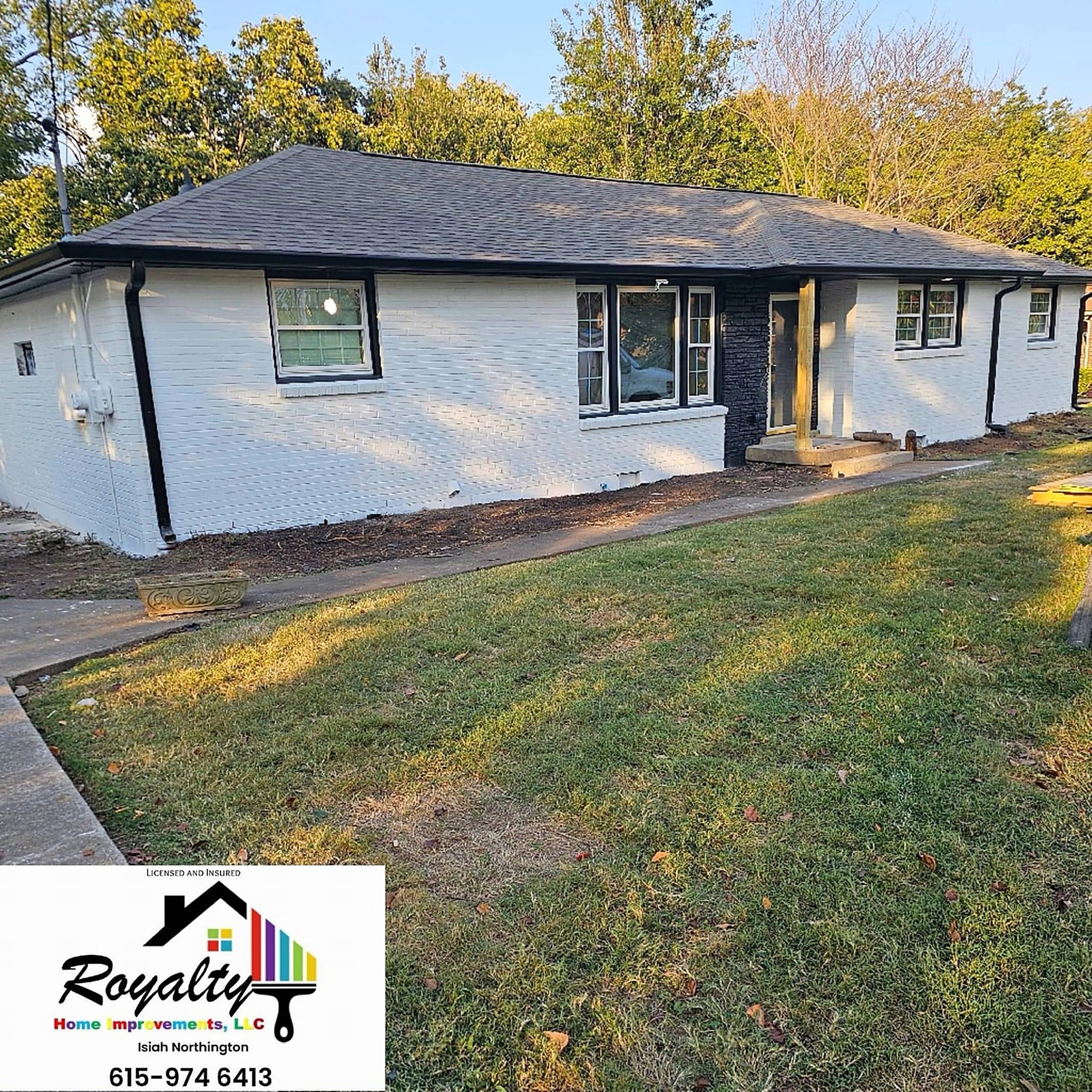 Freshly painted gray home exterior with dark trim