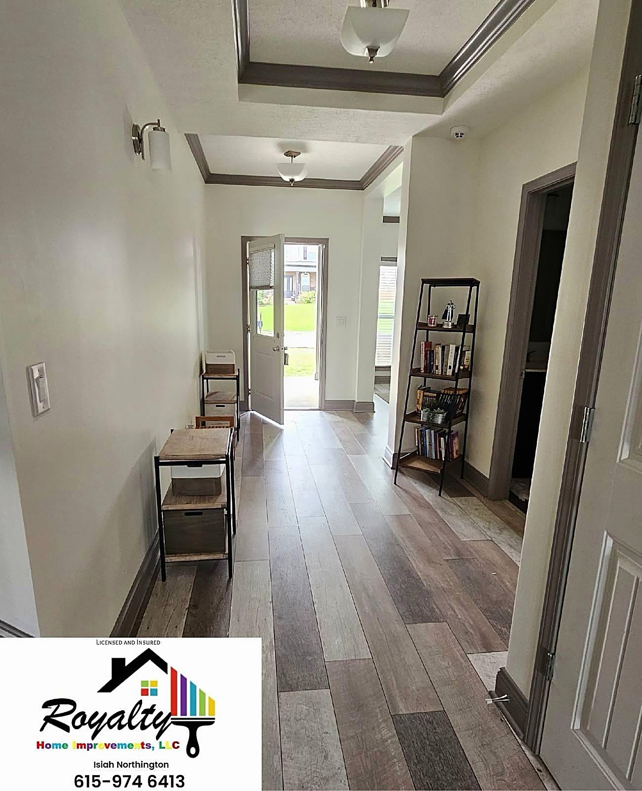 Bright hallway with crisp white walls and dark contrasting trim
