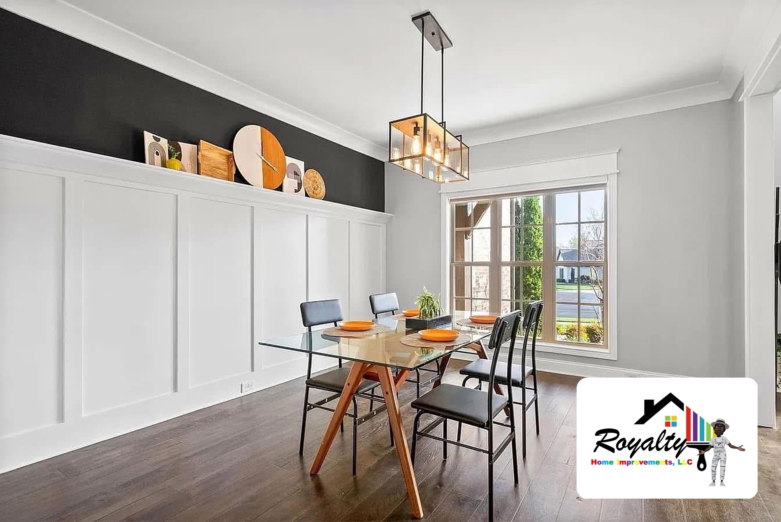 Bright dining nook beside a white kitchen with dark wood floors
